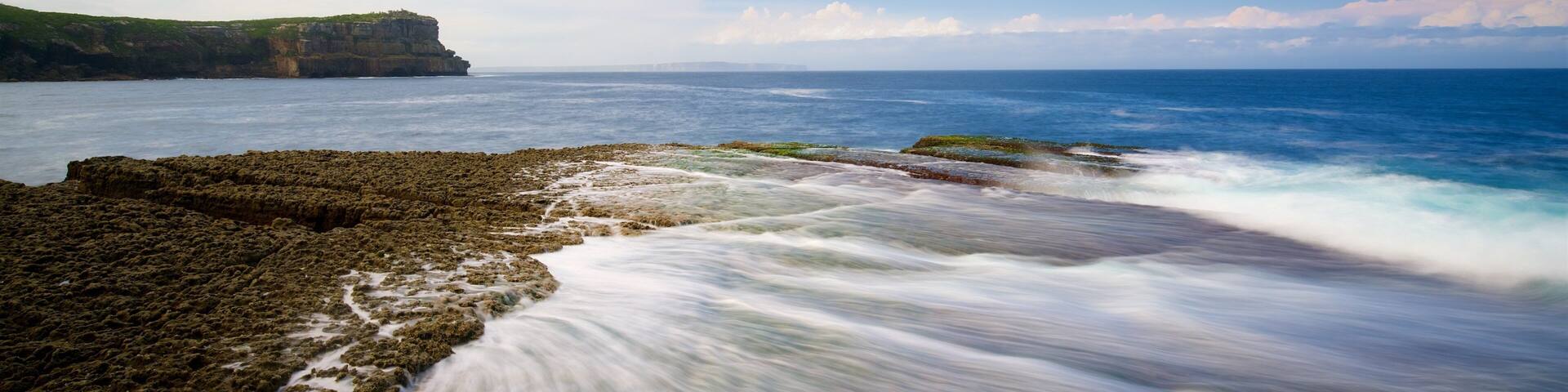 Booderee National Park featuring colorful reefs and rugged coastline
