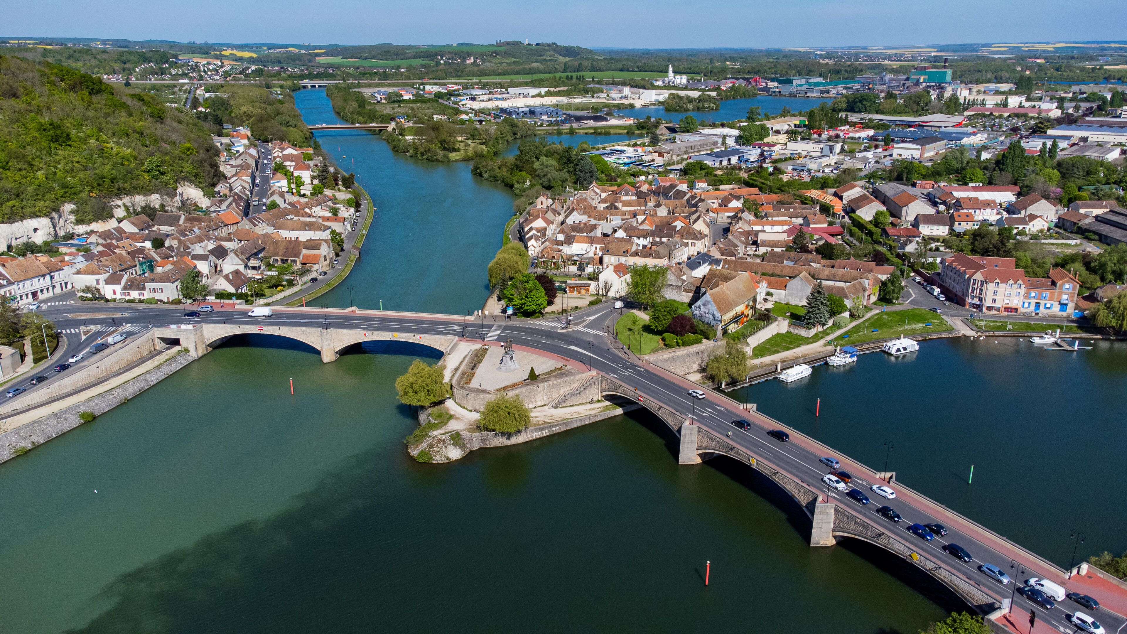 Aerial view of the confluence between the Seine and the Yonne showing different colors of water mixing in the town of Montereau Fault Yonne in Seine et Marne, France