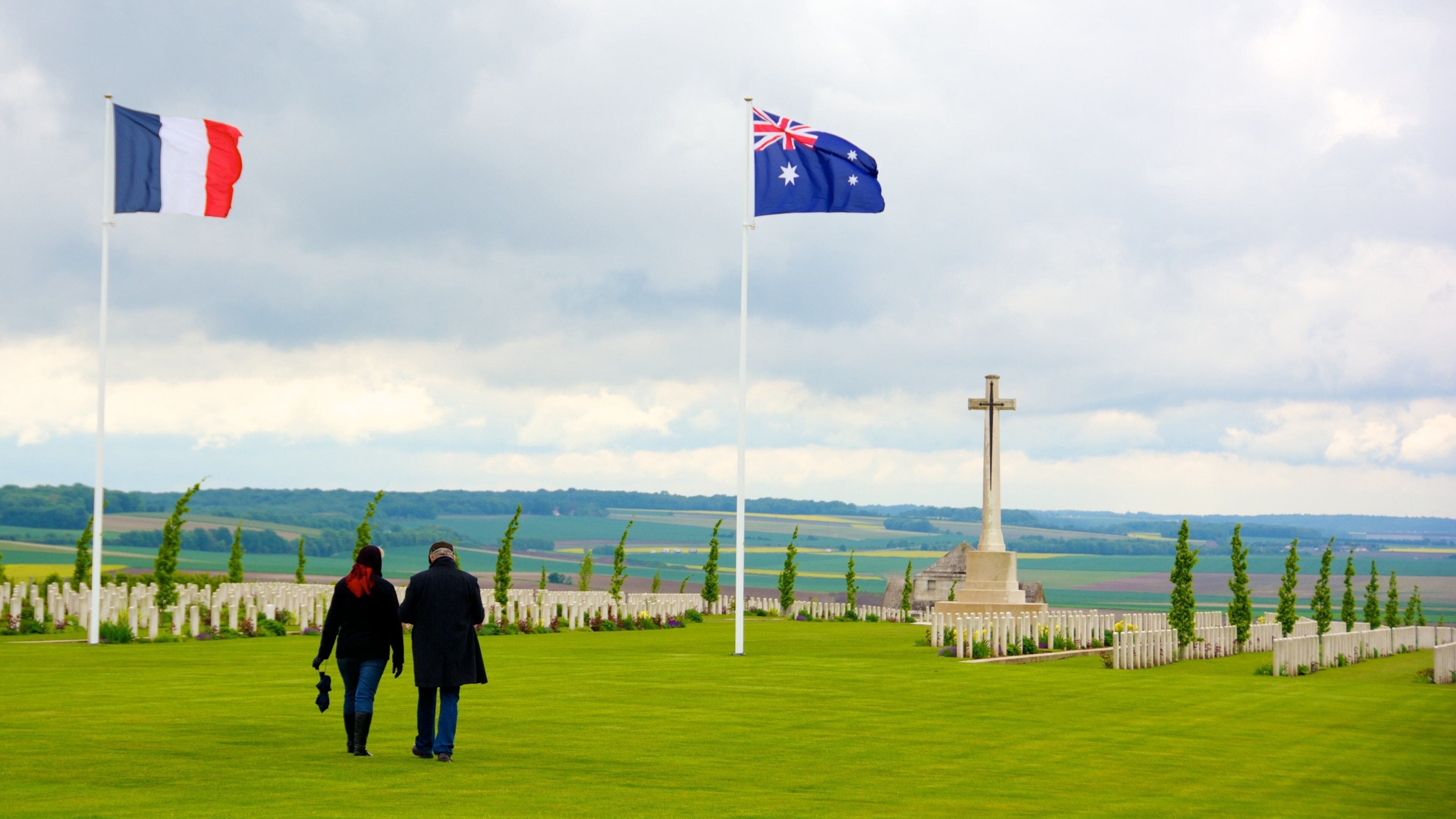Villers-Bretonneux featuring a cemetery and a memorial as well as a couple
