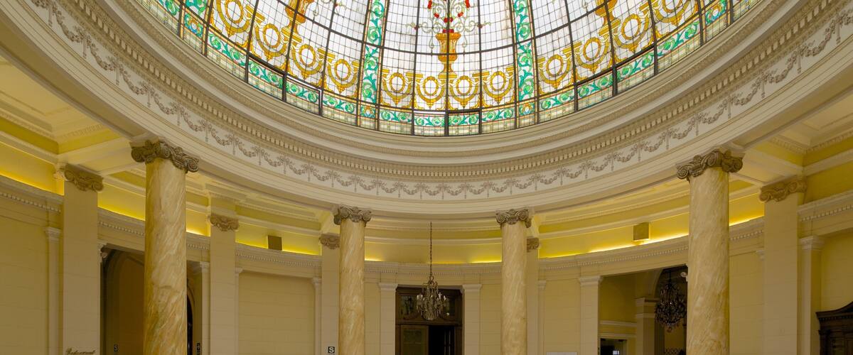 Plaza San Martin featuring interior views and heritage architecture as well as a large group of people