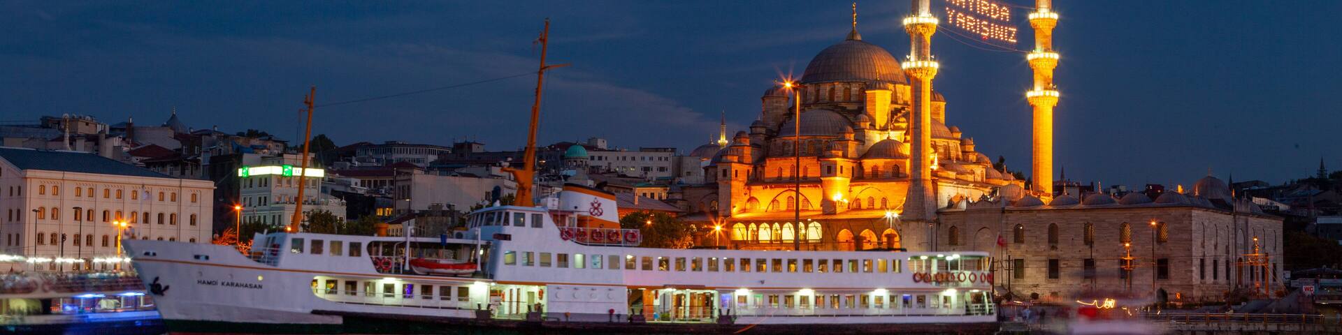 New Mosque showing a coastal town, a bay or harbor and heritage architecture