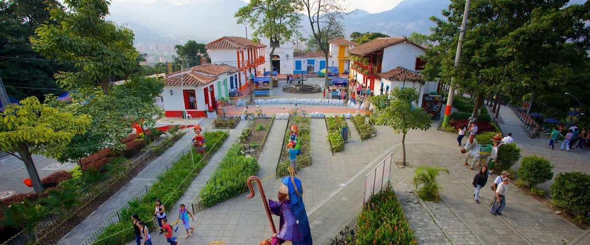 Pueblito Paisa featuring a garden, outdoor art and a small town or village