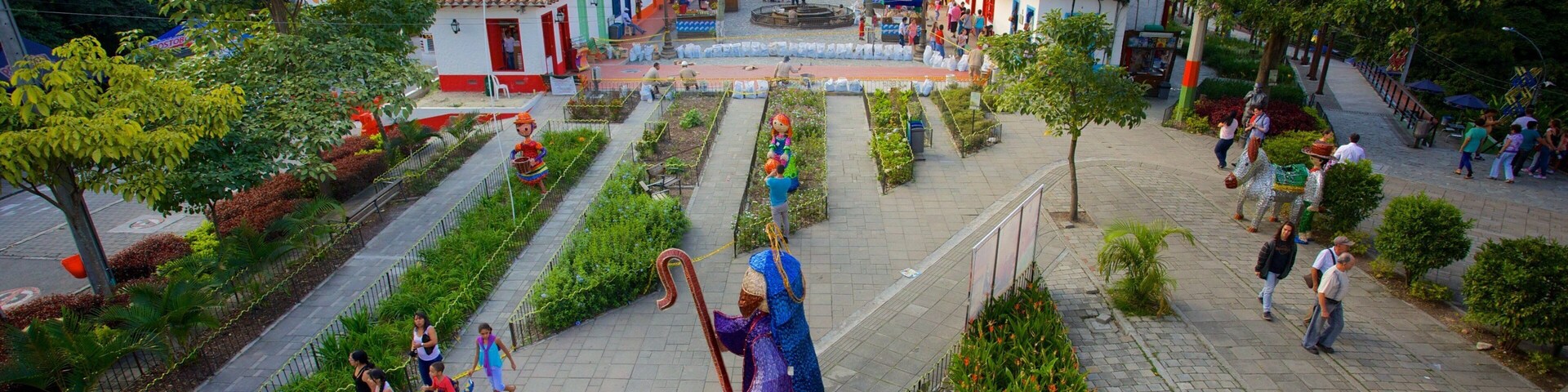 Pueblito Paisa showing outdoor art, a small town or village and a garden