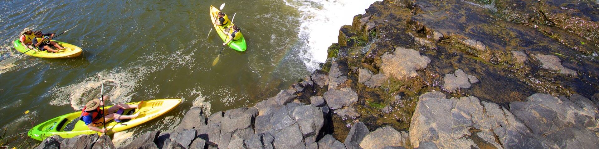 Haruru Falls featuring a river or creek, kayaking or canoeing and a cascade