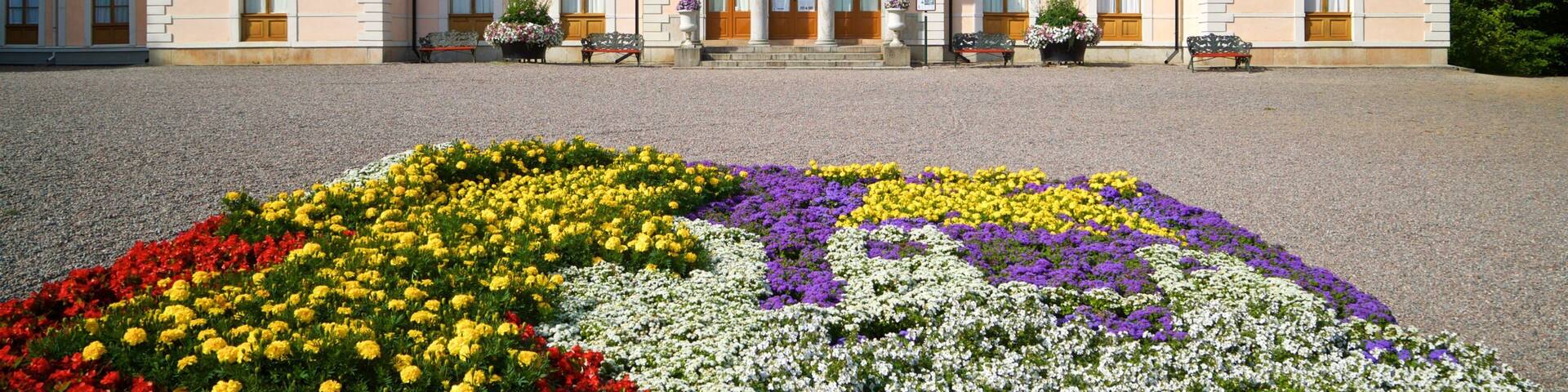 Rosendal Palace which includes heritage architecture, a castle and flowers