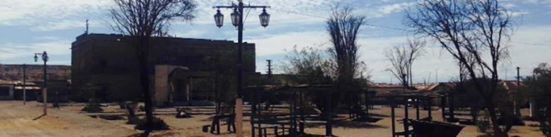 The main plaza of the deserted mining town Humberstone. About 30 minute bus ride from Iquique. Buses leave from Mercado centenario and cost 2000 pesos. They leave you right next to the town and you can spend hours and hours exploring the buildings and artifacts found in the town. Buses leave every 20 min.
