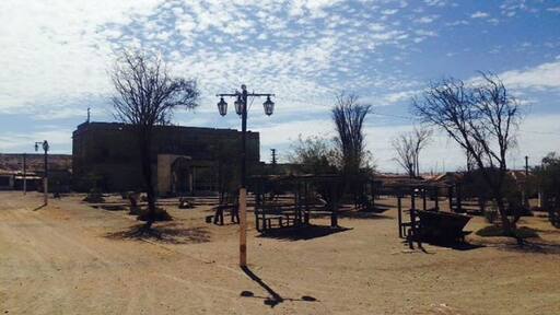 The main plaza of the deserted mining town Humberstone. About 30 minute bus ride from Iquique. Buses leave from Mercado centenario and cost 2000 pesos. They leave you right next to the town and you can spend hours and hours exploring the buildings and artifacts found in the town. Buses leave every 20 min.
