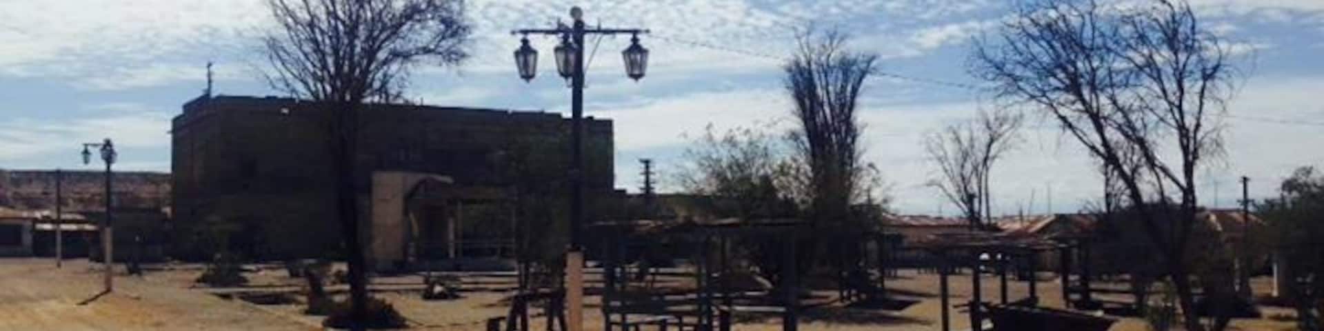 The main plaza of the deserted mining town Humberstone. About 30 minute bus ride from Iquique. Buses leave from Mercado centenario and cost 2000 pesos. They leave you right next to the town and you can spend hours and hours exploring the buildings and artifacts found in the town. Buses leave every 20 min.