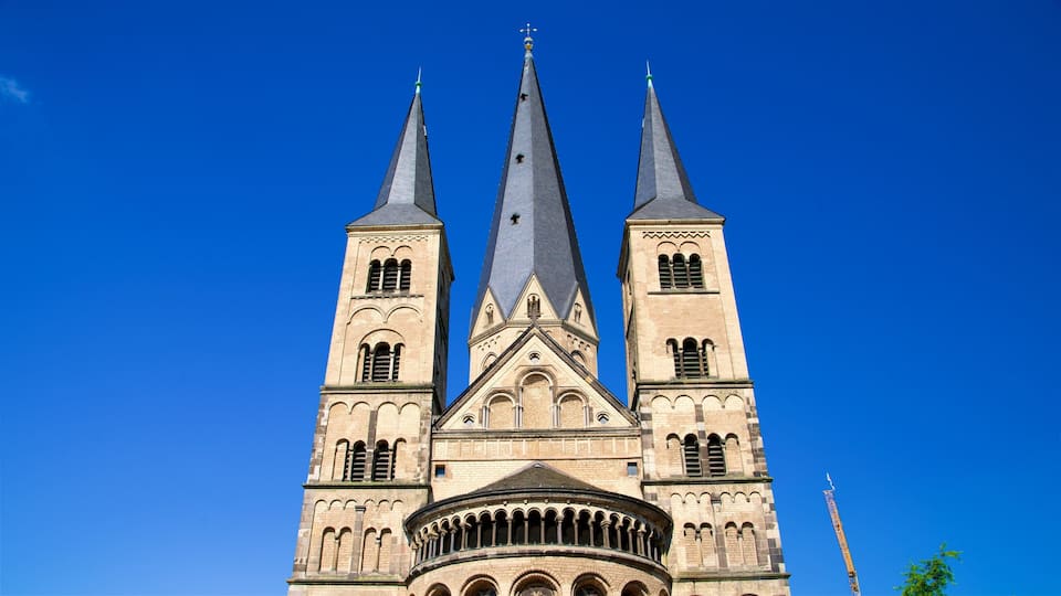 A large church with three spires and a circular balcony.