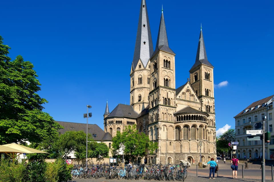 A historic cathedral with two tall spires and a large circular window.