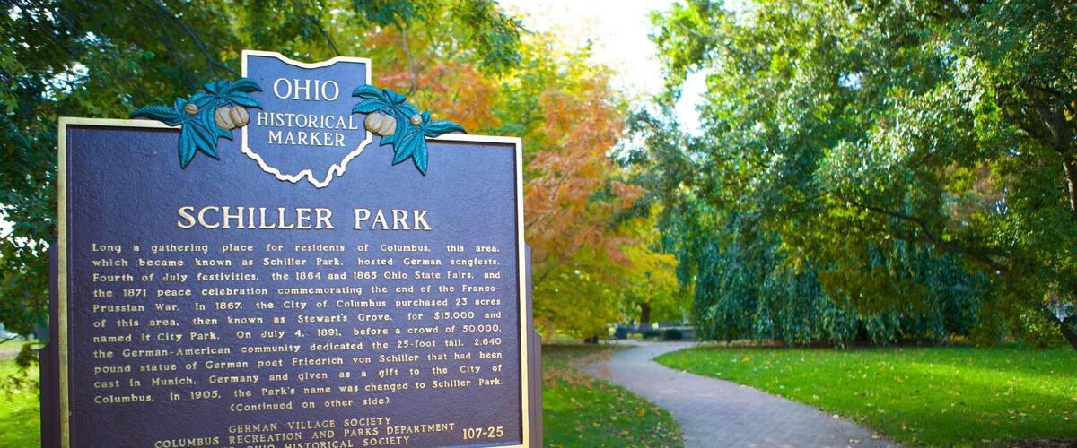 Schiller Park showing signage and a garden