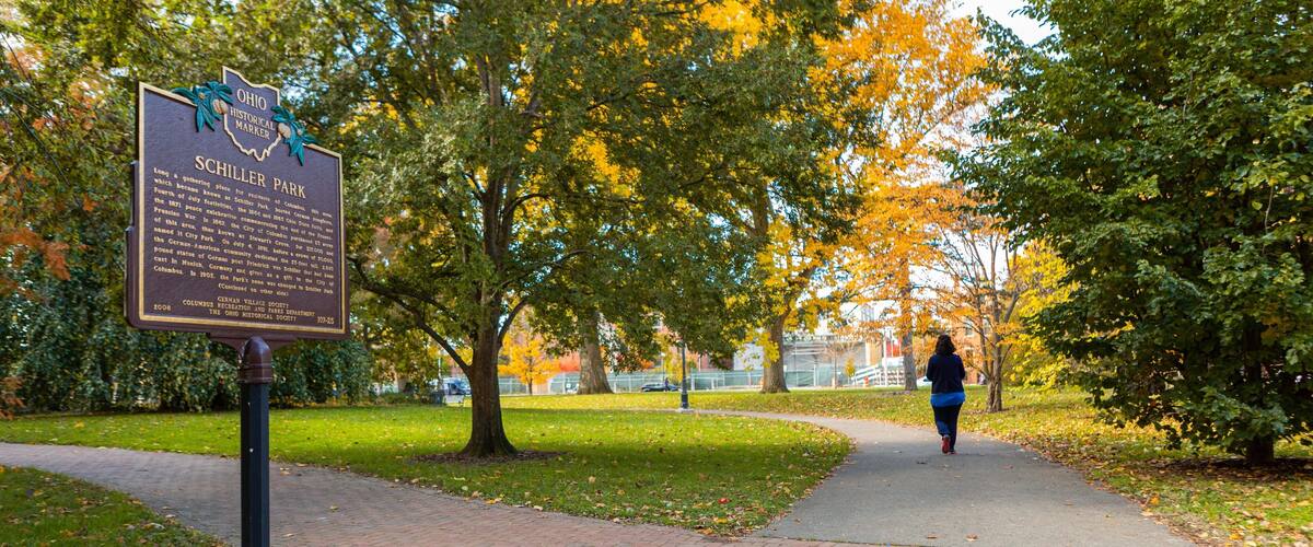 Schiller Park which includes a garden, signage and fall colors