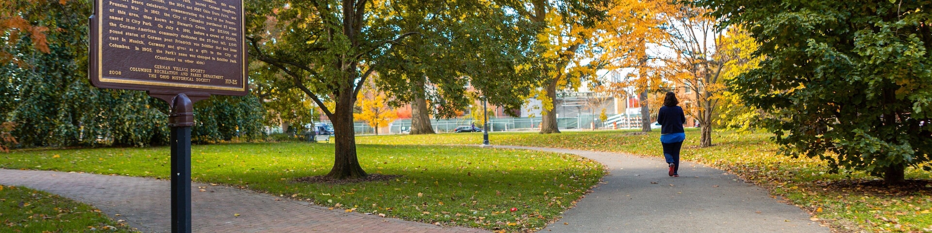 Schiller Park which includes a garden, signage and fall colors