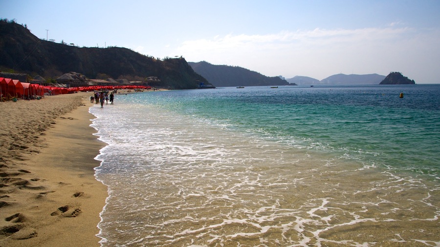 Blanca Beach showing a sandy beach and landscape views