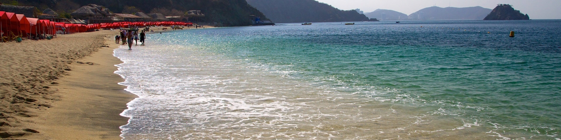 Blanca Beach showing a sandy beach and landscape views