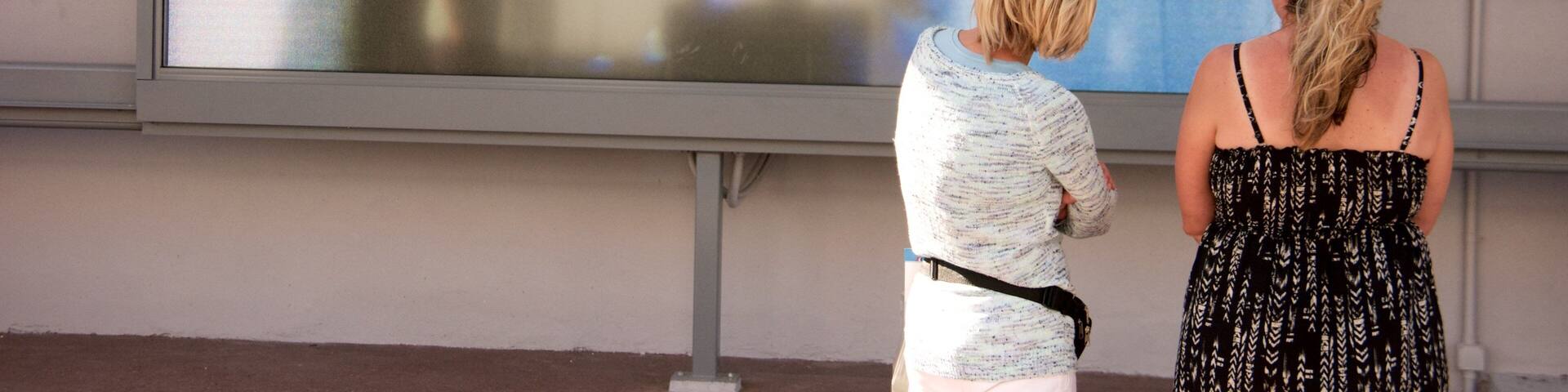 Bee Gees Way showing outdoor art as well as a small group of people