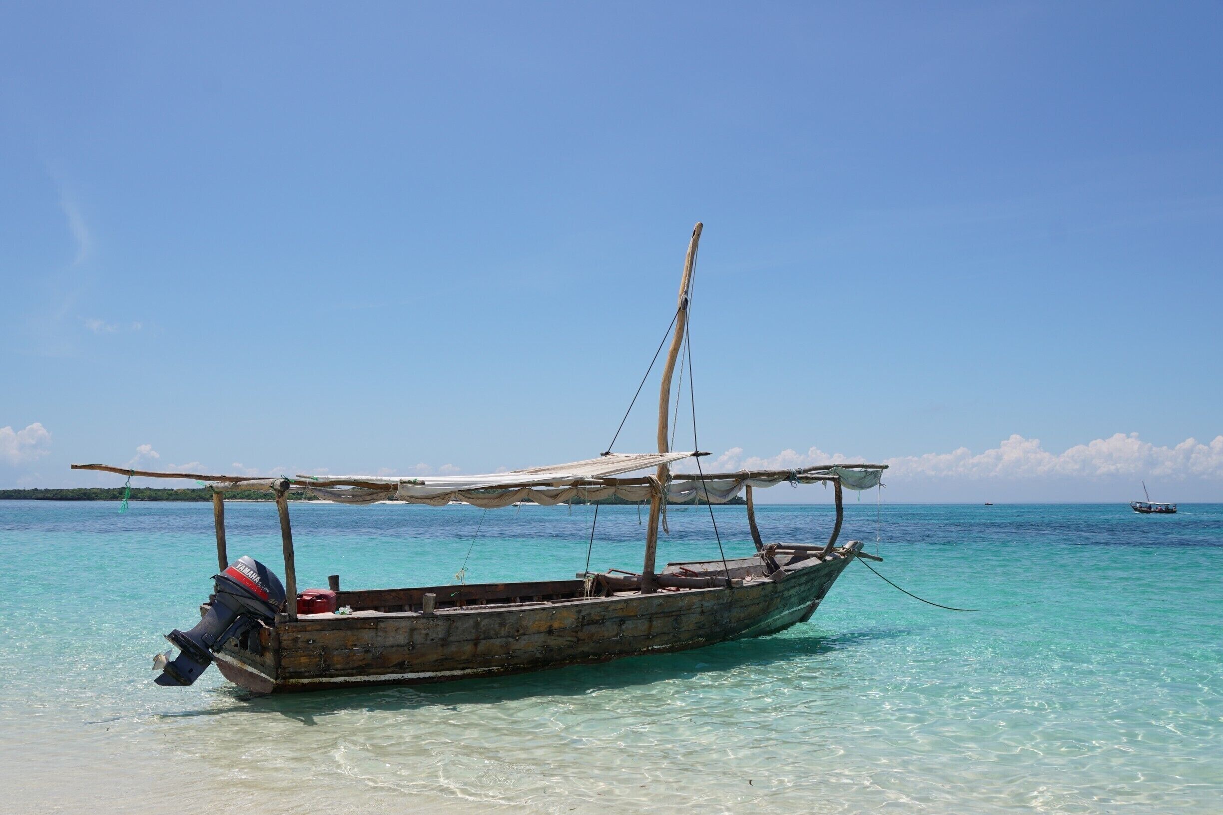 Dhows moored off the sand bank.  The first stop of the morning for swimming in crystal clear waters and eating of local fresh tropical fruit.