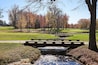 A picturesque view of a creek in a golf country club in Wilmington, Delaware