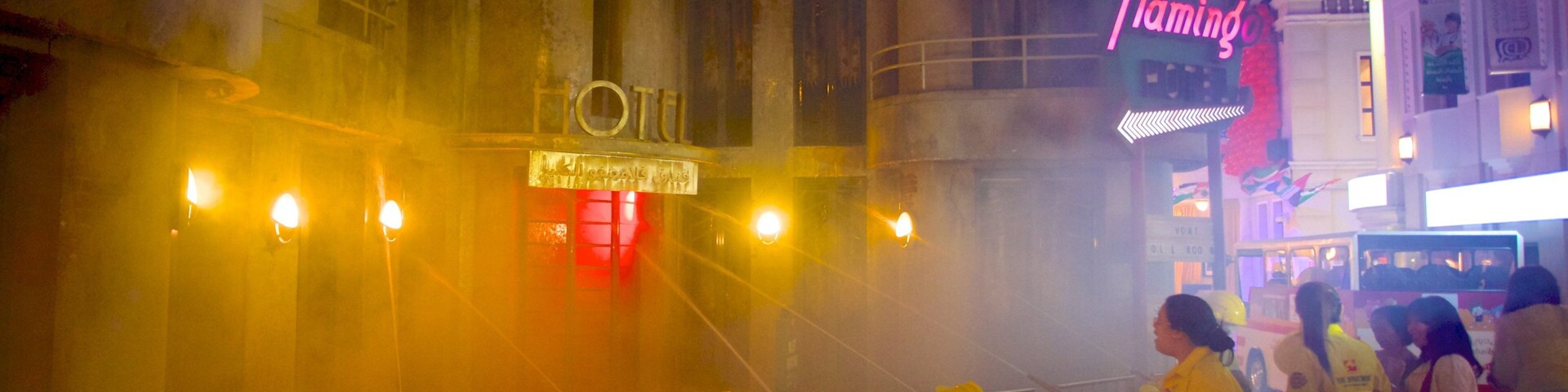 KidZania featuring a city and signage as well as a large group of people