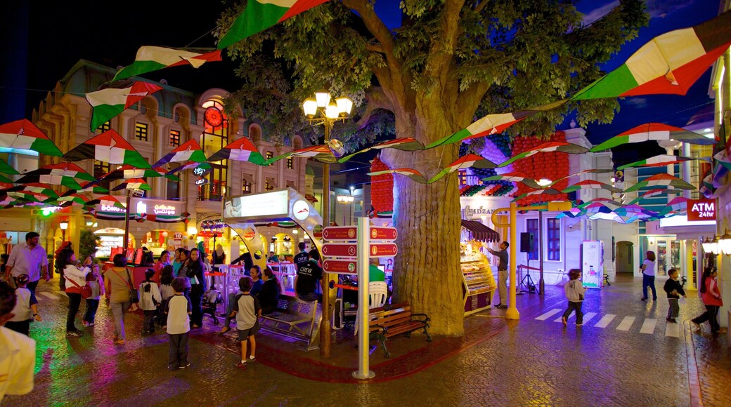 Dubai Mall which includes night scenes, a city and nightlife