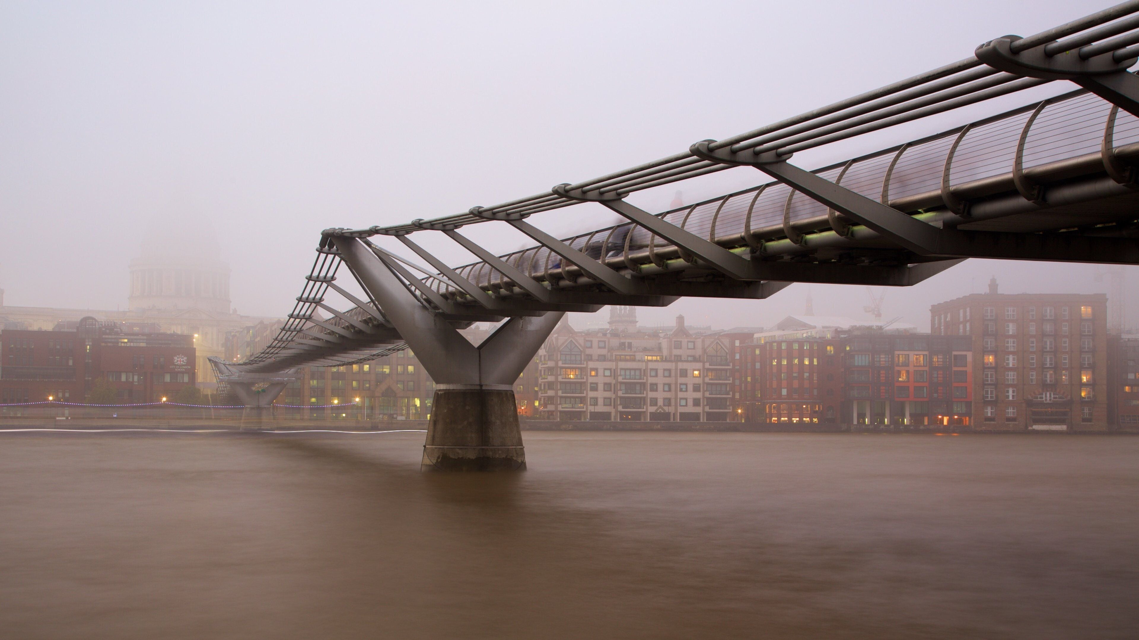 London Millennium Footbridge which includes a river or creek, a bridge and mist or fog