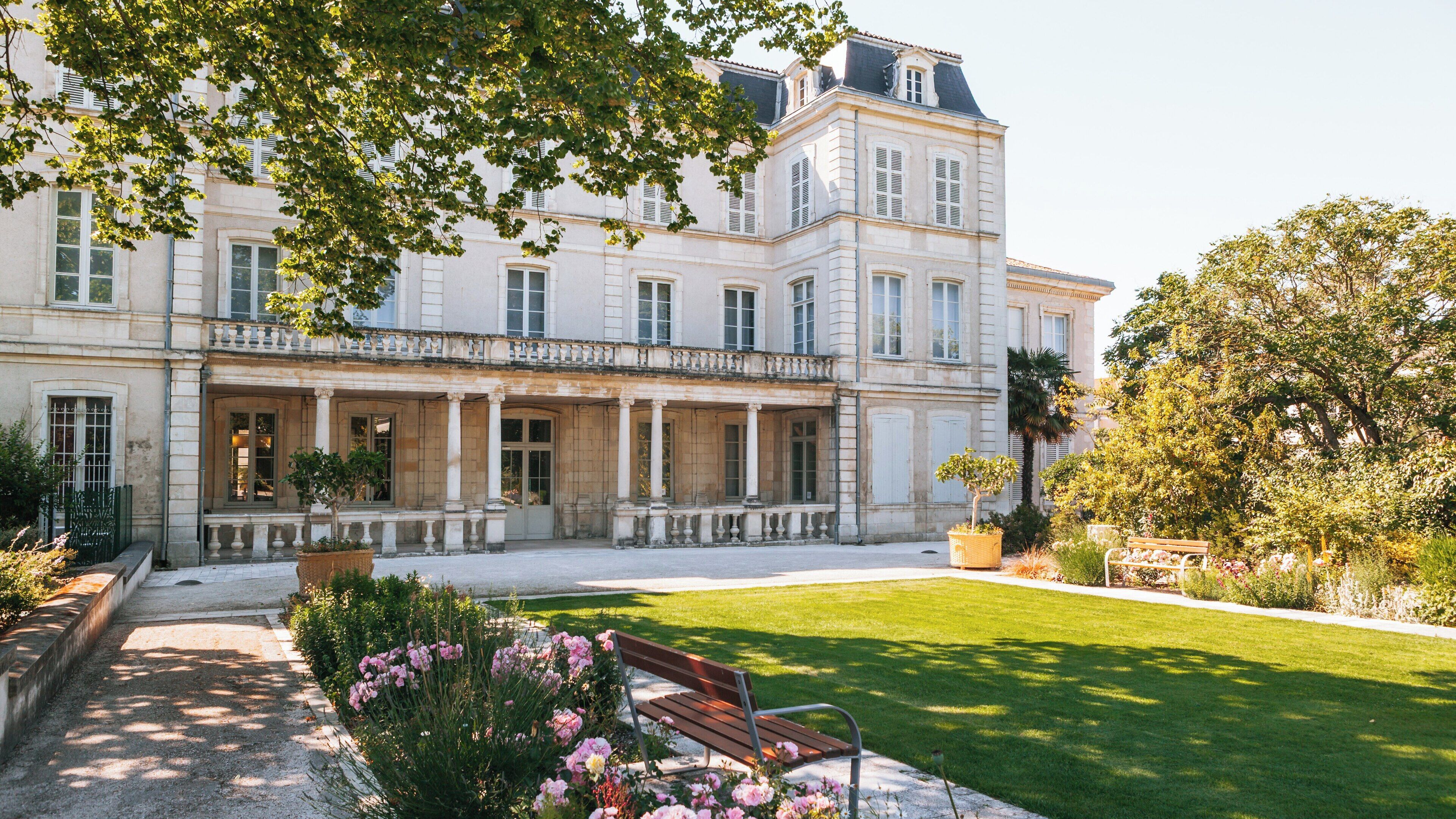 Natural History Museum of La Rochelle showcases elegant architecture amidst lush gardens in Nouvelle-Aquitaine, France