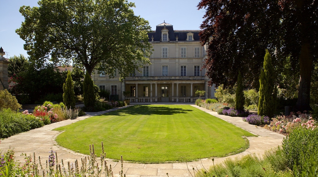Natural History Museum featuring a park and a house
