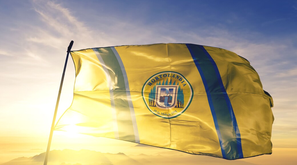 Hortolandia of Brazil flag waving on the top sunrise mist fog