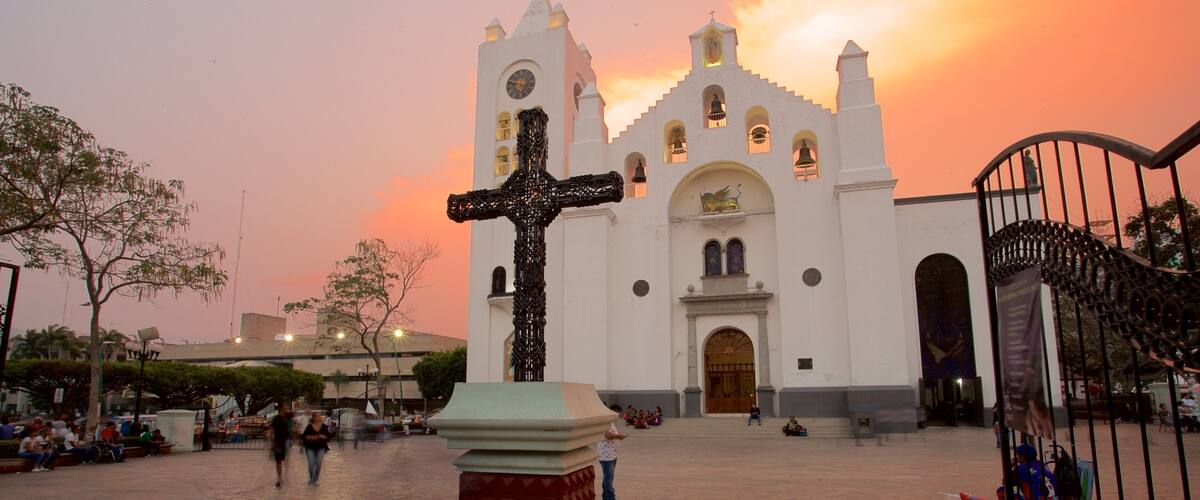 San Marcos Cathedral featuring heritage architecture, a sunset and religious elements