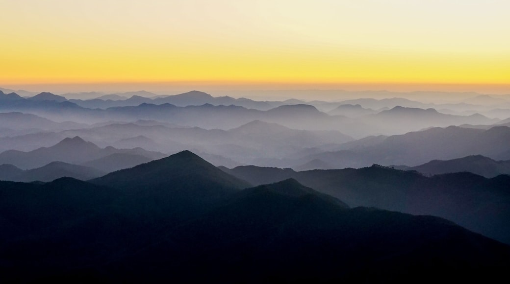 Silhouettes of the Serra da Mantiqueira's mountain range during sunset, seen from Marins Peak. Piquete, Sao Paulo, Brazil