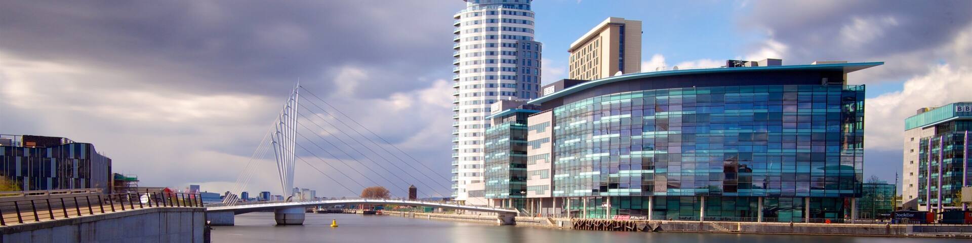 Salford Quays which includes a bridge, a city and modern architecture