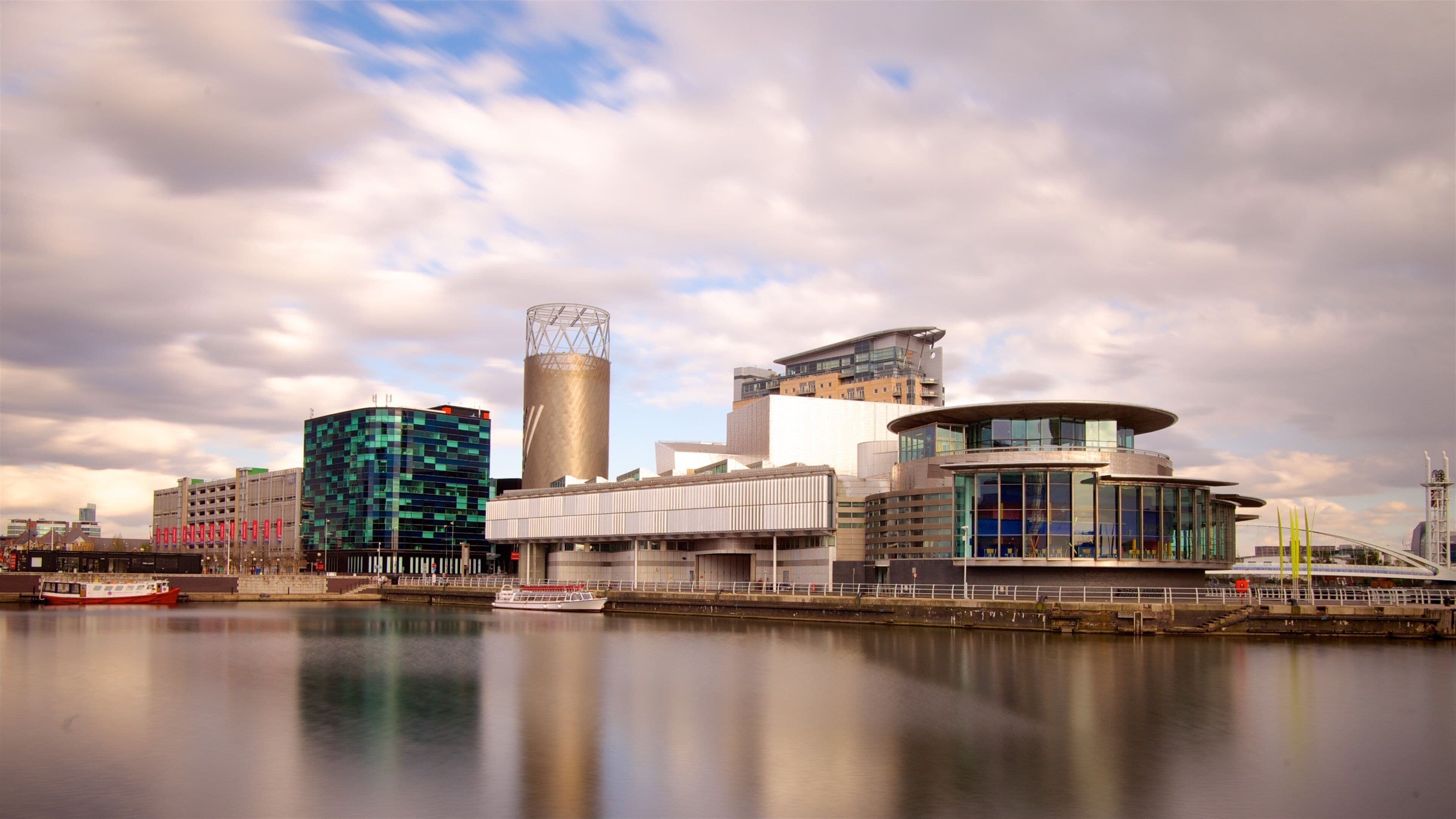 Salford Quays which includes a river or creek, modern architecture and a city