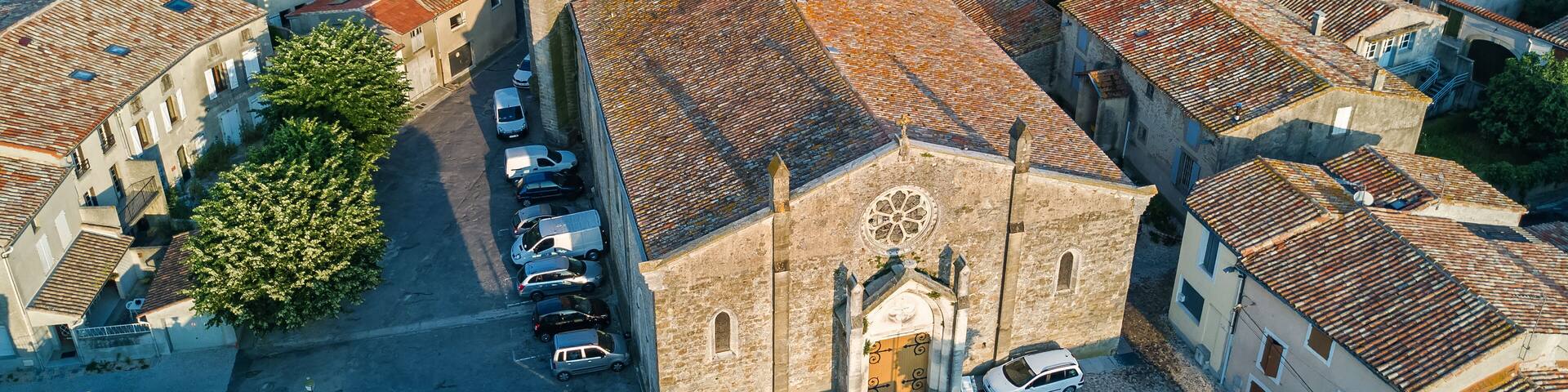 Aerial top view of Bram medieval village architecture and roofs from above, Southern France