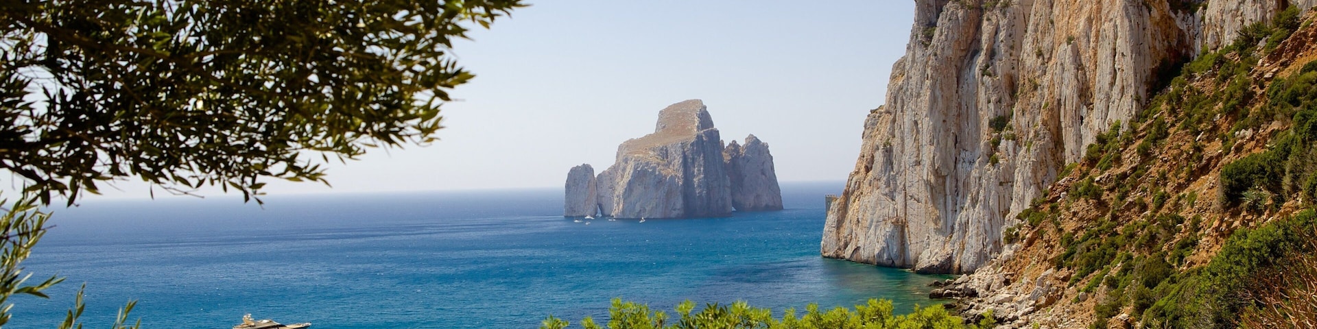 Porto Flavia featuring rocky coastline