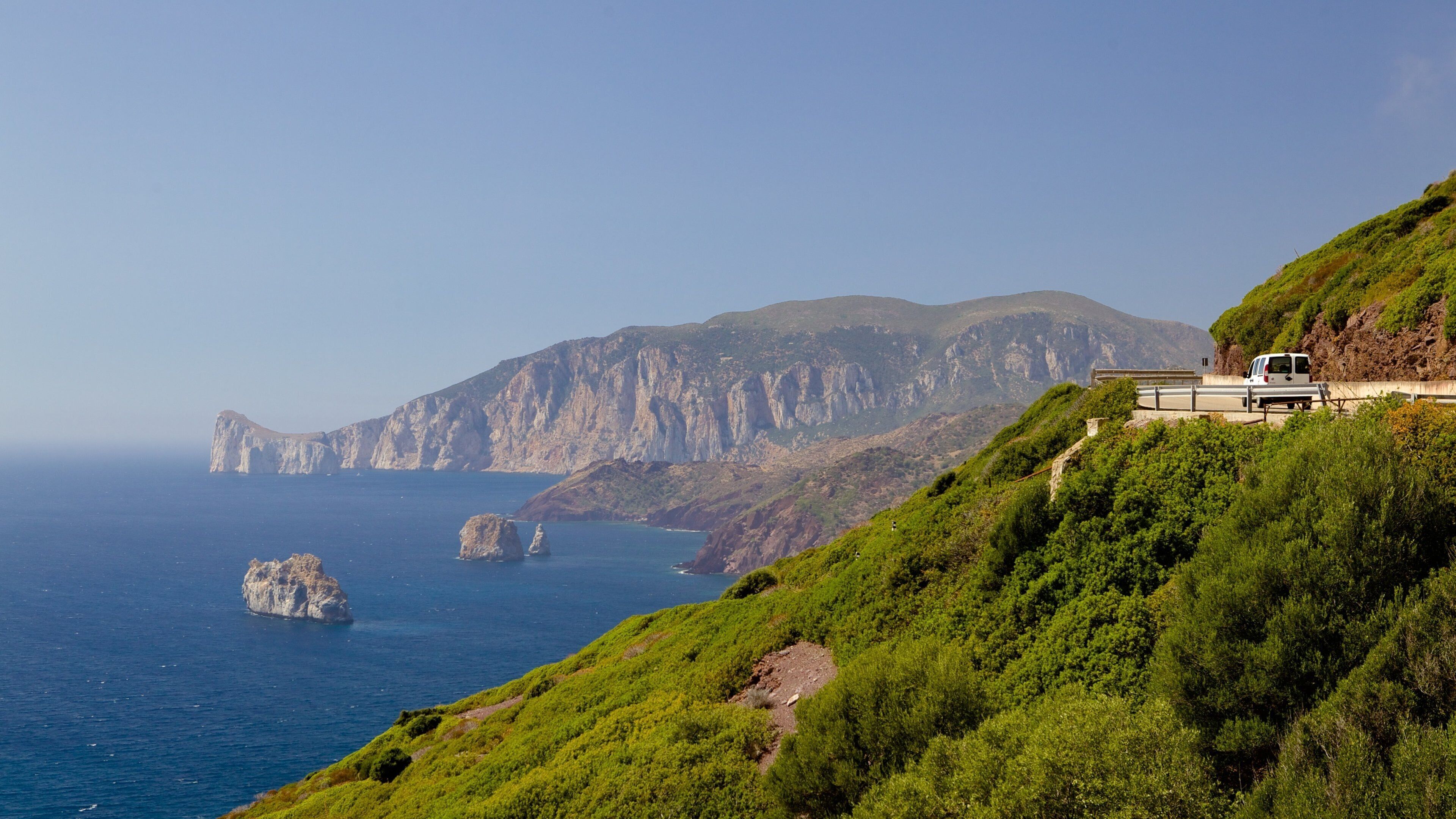 Porto Flavia featuring rocky coastline