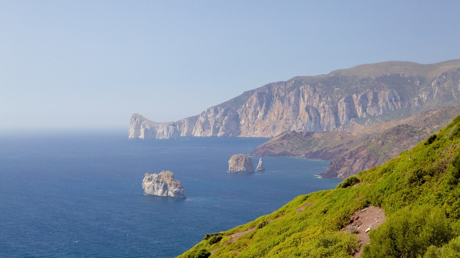 Porto Flavia featuring rocky coastline