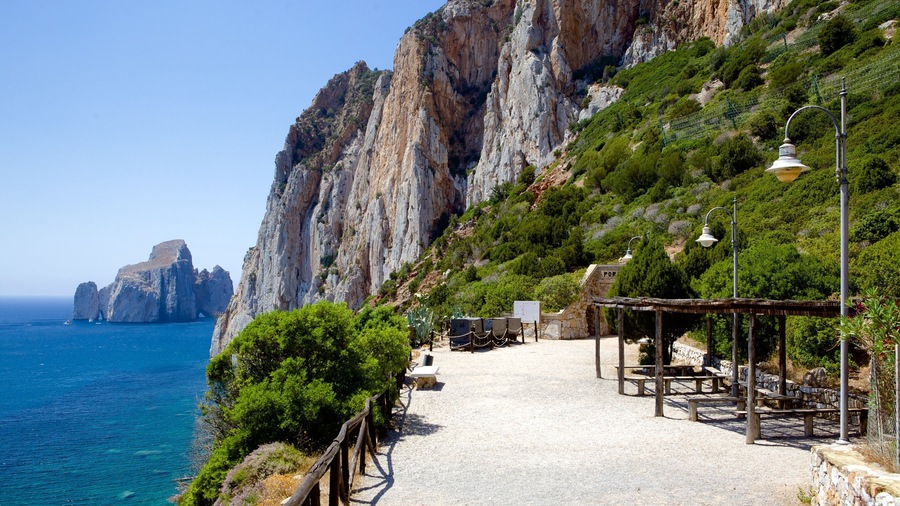 Porto Flavia featuring rocky coastline