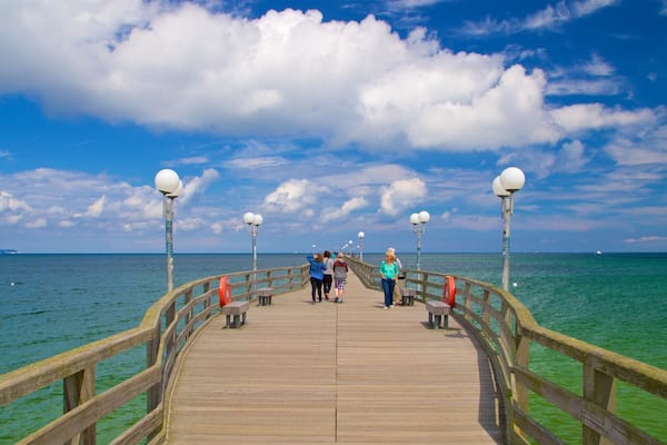 Binz Pier which includes general coastal views as well as a small group of people