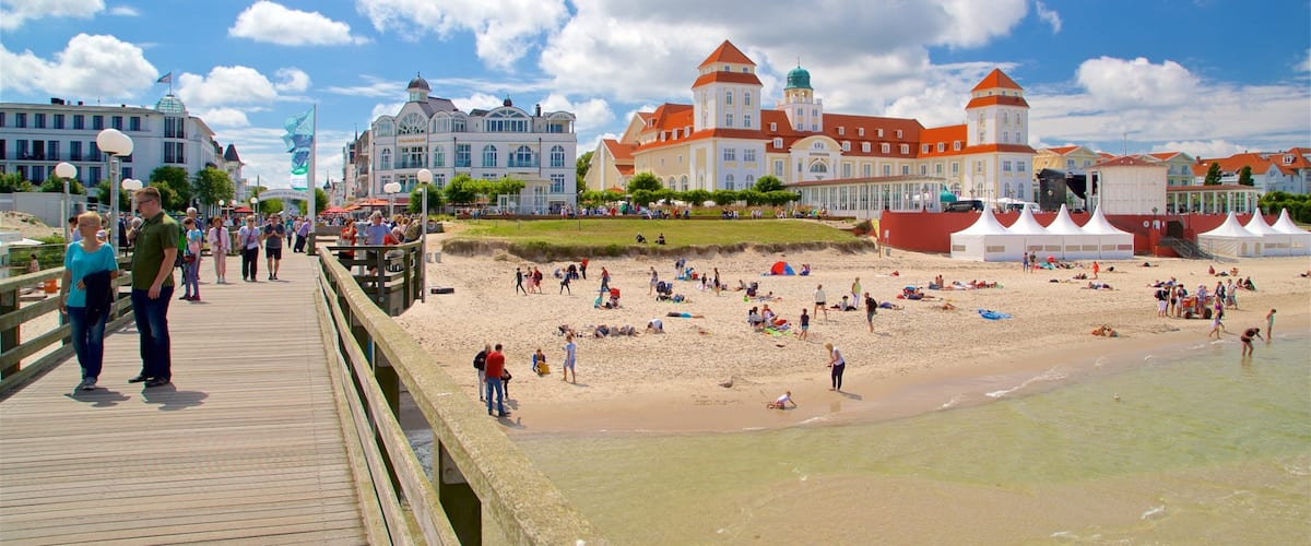 Binz Pier which includes general coastal views, a sandy beach and a coastal town