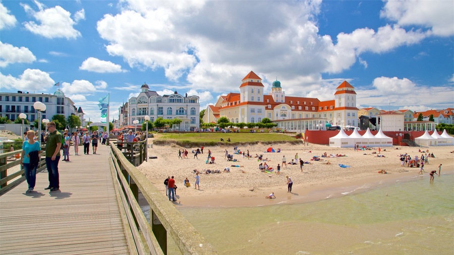 Binz Pier which includes general coastal views, a sandy beach and a coastal town