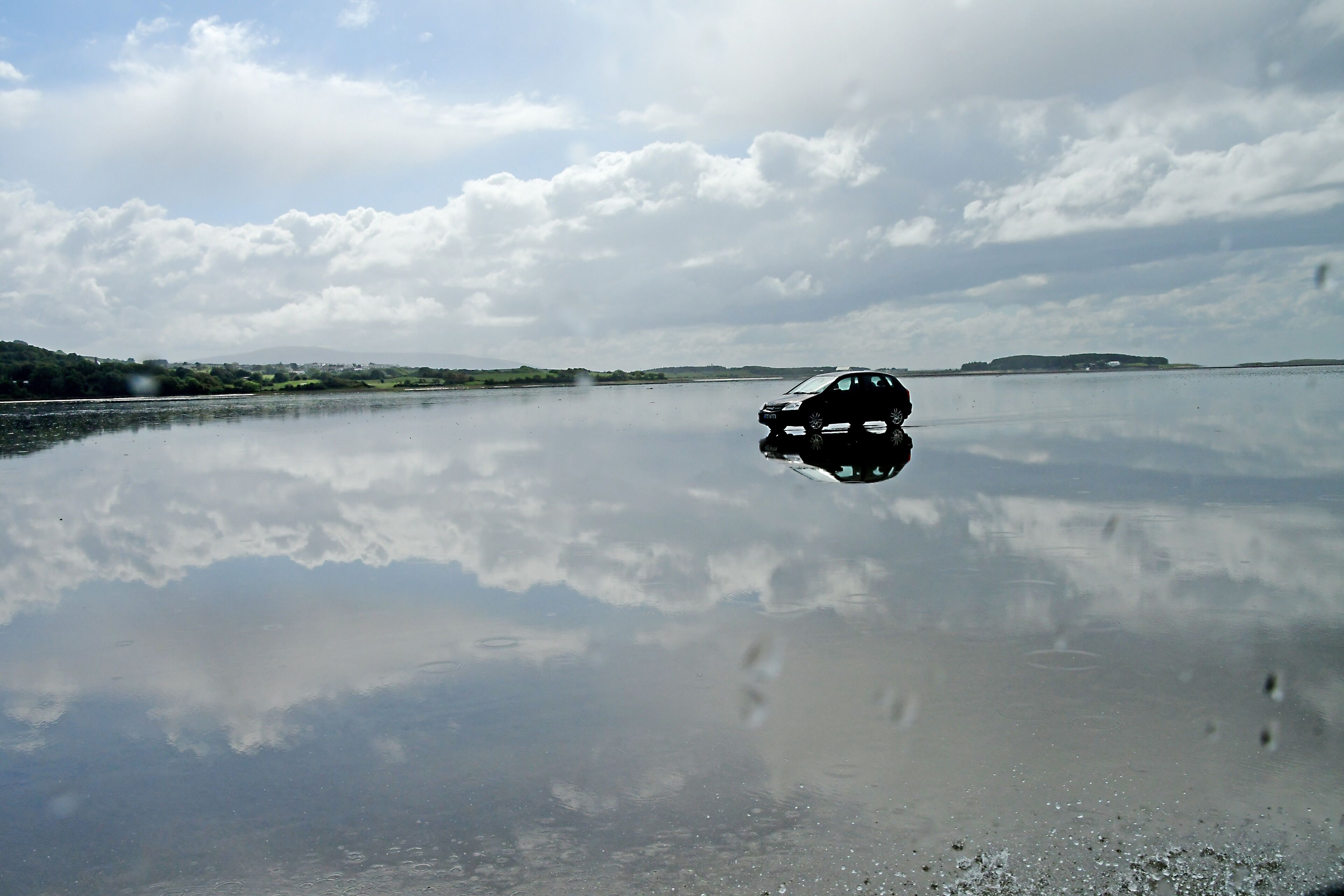 There are no bridges to Coney Island. But you can drive to the island at low tide.