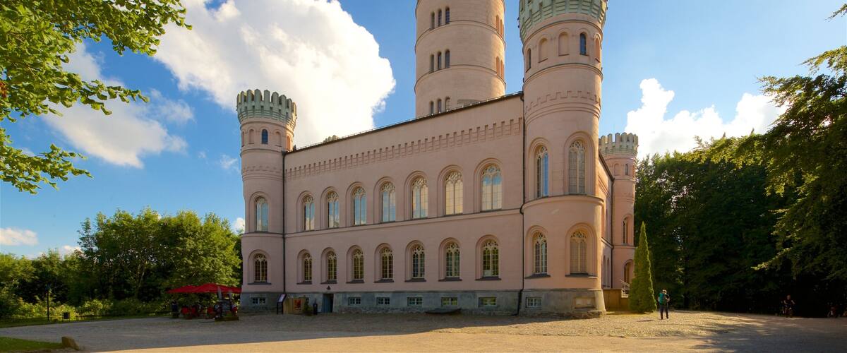 A castle with two towers and arched windows.