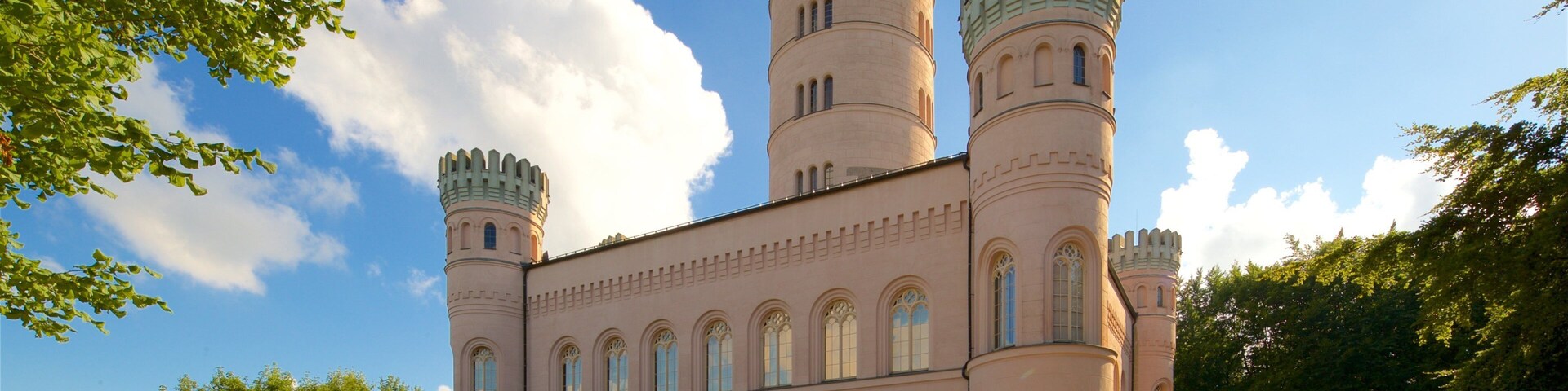 A castle with two towers and arched windows.