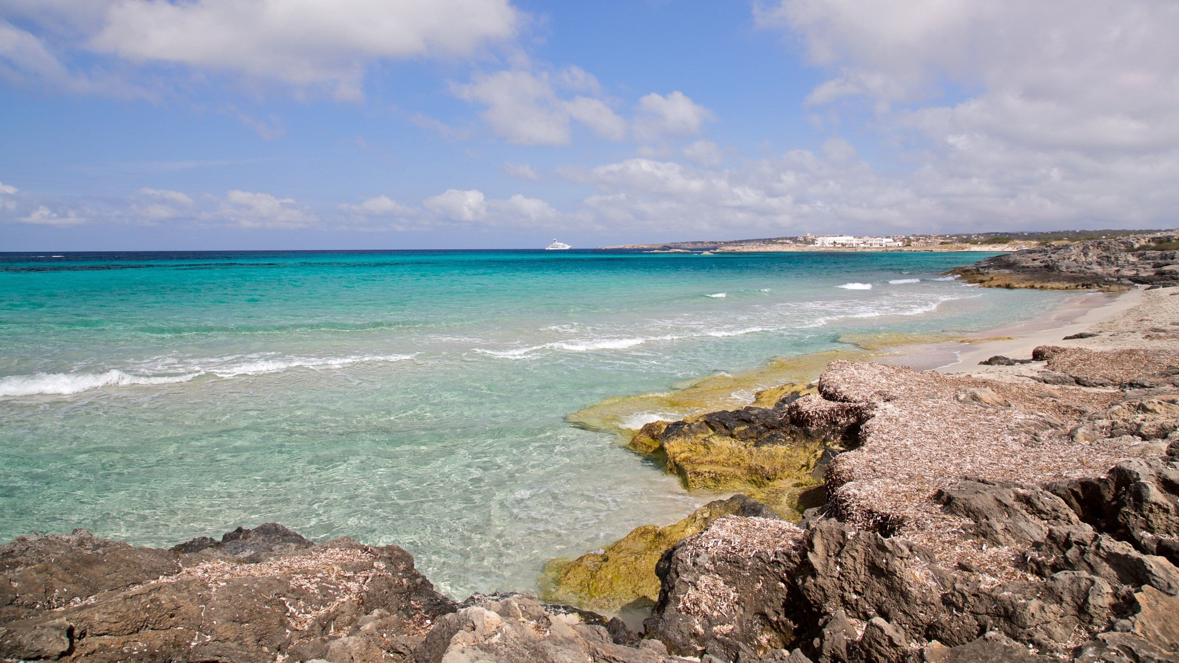 Sa Roqueta Beach featuring rugged coastline and general coastal views
