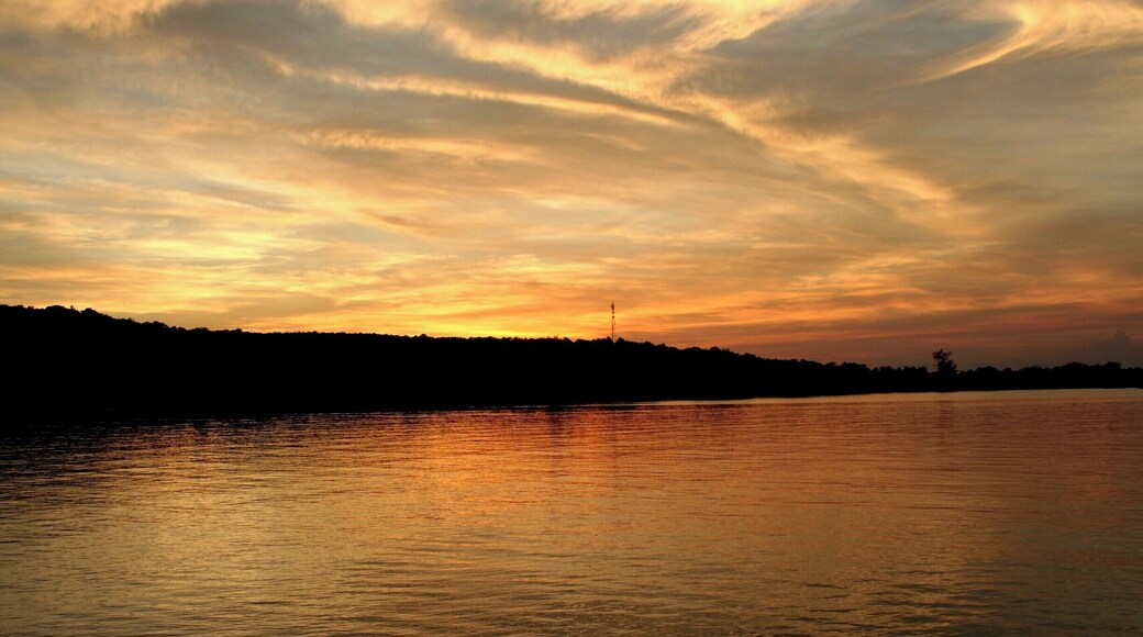 Sunset seen from Ecosea dive resort in M'pay Bay. If you go in the water at night, the plankton lights up as you move. It's a crazy experience!