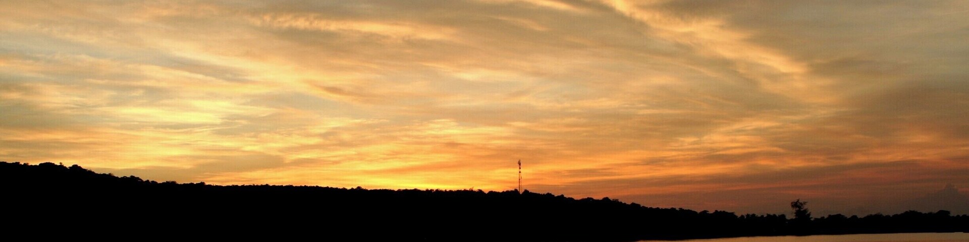 Sunset seen from Ecosea dive resort in M'pay Bay. If you go in the water at night, the plankton lights up as you move. It's a crazy experience!
