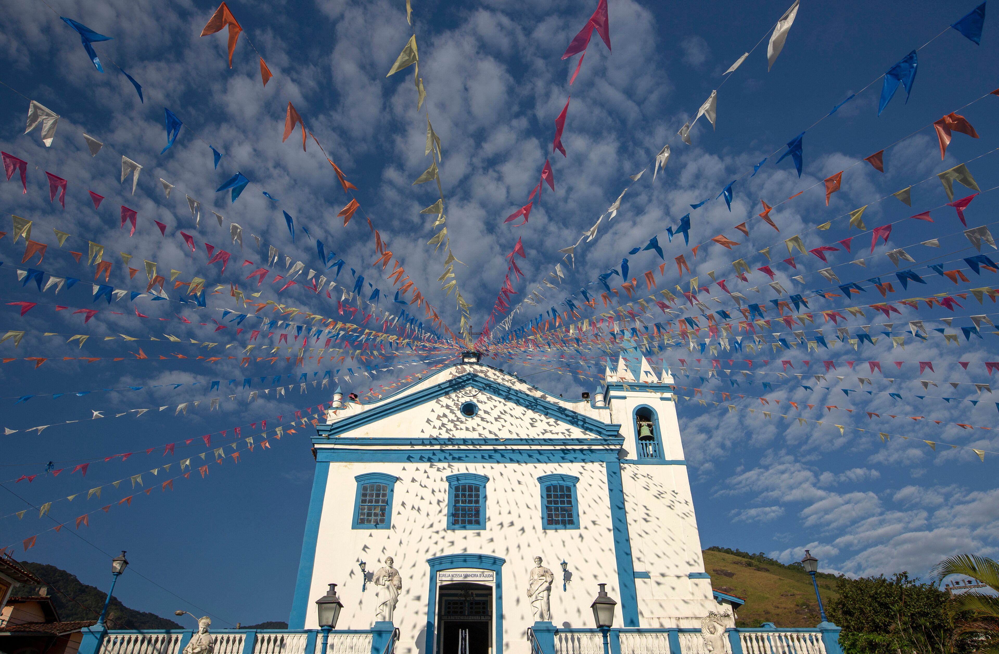 Church of Our Lady of Help, or Nossa Senhora d Ajuda in portuguese, decorated with June festival flags. Ilhabela, colonial town on the coast of Sao Paulo state, Brazil