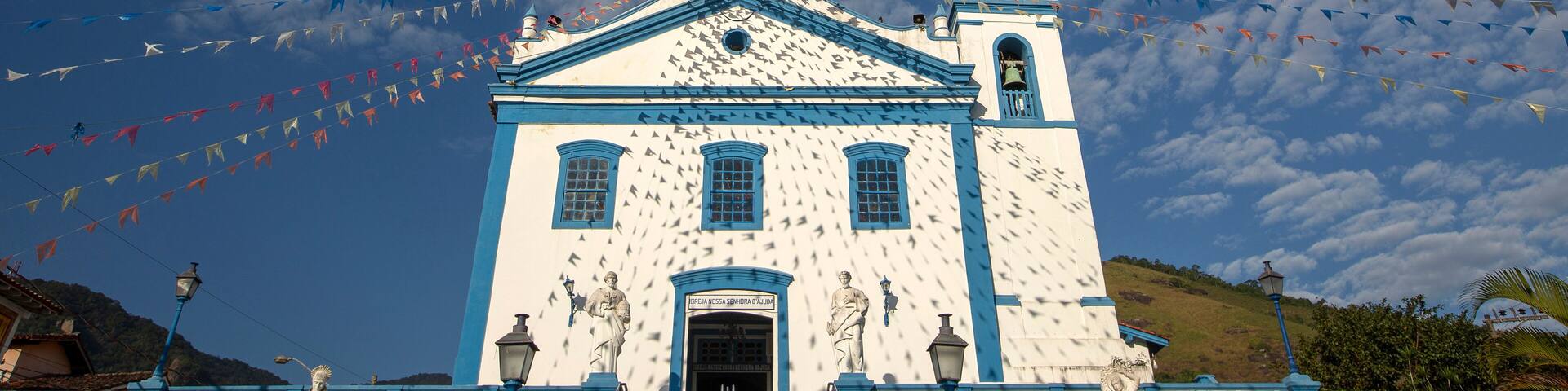 Church of Our Lady of Help, or Nossa Senhora d Ajuda in portuguese, decorated with June festival flags. Ilhabela, colonial town on the coast of Sao Paulo state, Brazil