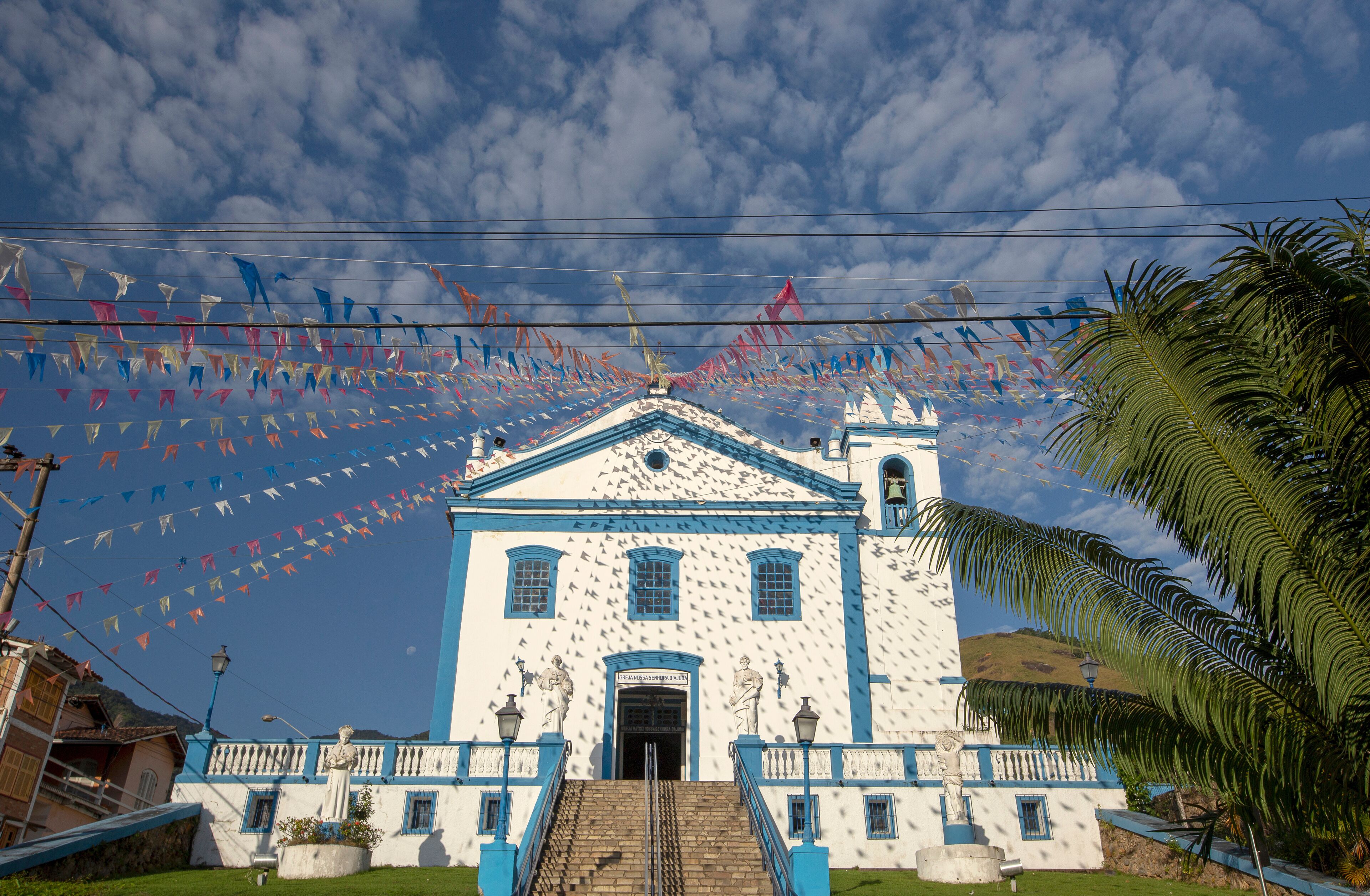 Church of Our Lady of Help, or Nossa Senhora d Ajuda in portuguese, decorated with June festival flags. Ilhabela, colonial town on the coast of Sao Paulo state, Brazil	
