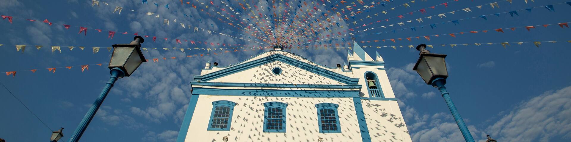Church of Our Lady of Help, or Nossa Senhora d Ajuda in portuguese, decorated with June festival flags. Ilhabela, colonial town on the coast of Sao Paulo state, Brazil